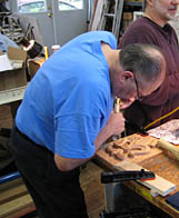 Student learning how to carve wood Student carving wood